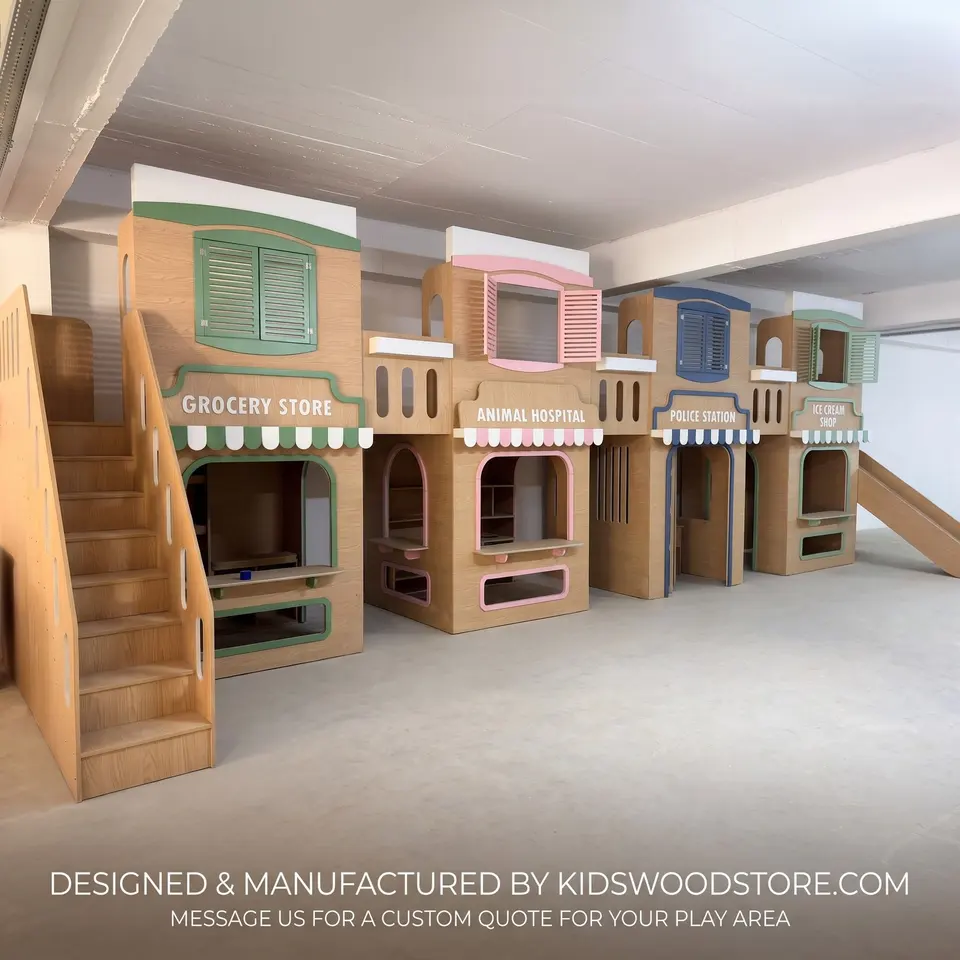 Angled view of wooden playhouse row with stairs and upper deck