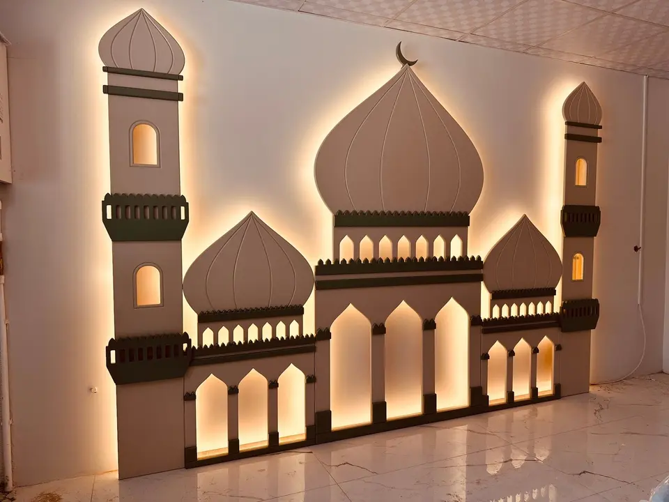 Backlit wooden mosque silhouette decor mounted on indoor wall with warm lighting