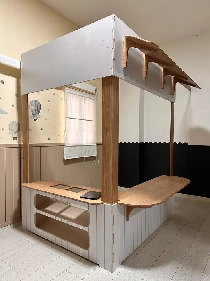 White and natural wood indoor play market stand in playroom