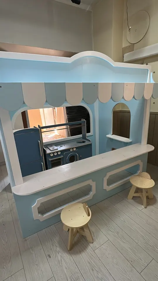 Light blue wooden play kitchen and market counter with stools