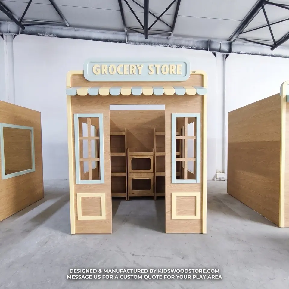 Wooden play grocery store playhouse with awning and interior shelving