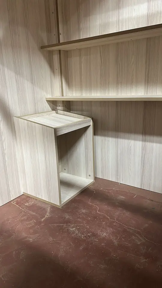 Interior shelf and small counter unit inside wooden playhouse