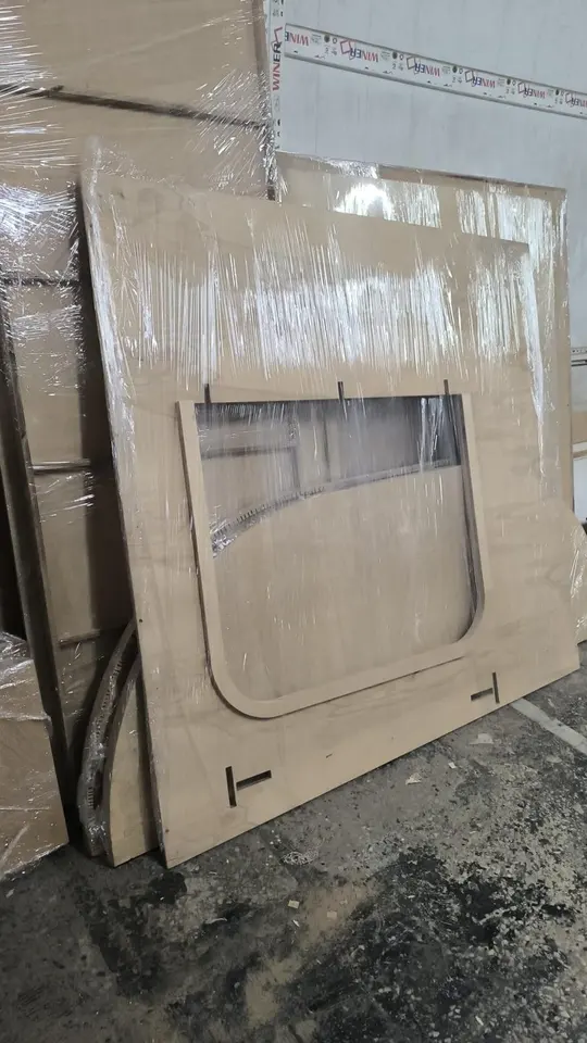 Plastic wrapped wooden playhouse wall panels ready for shipping