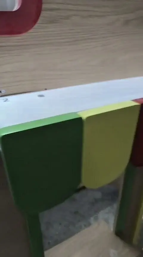 Colorful awning detail on wooden market playhouse stall