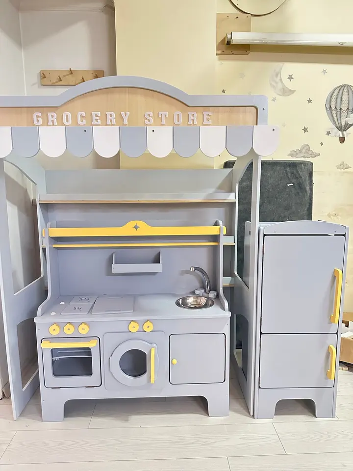 Grey wooden play grocery store stand with play sink and refrigerator